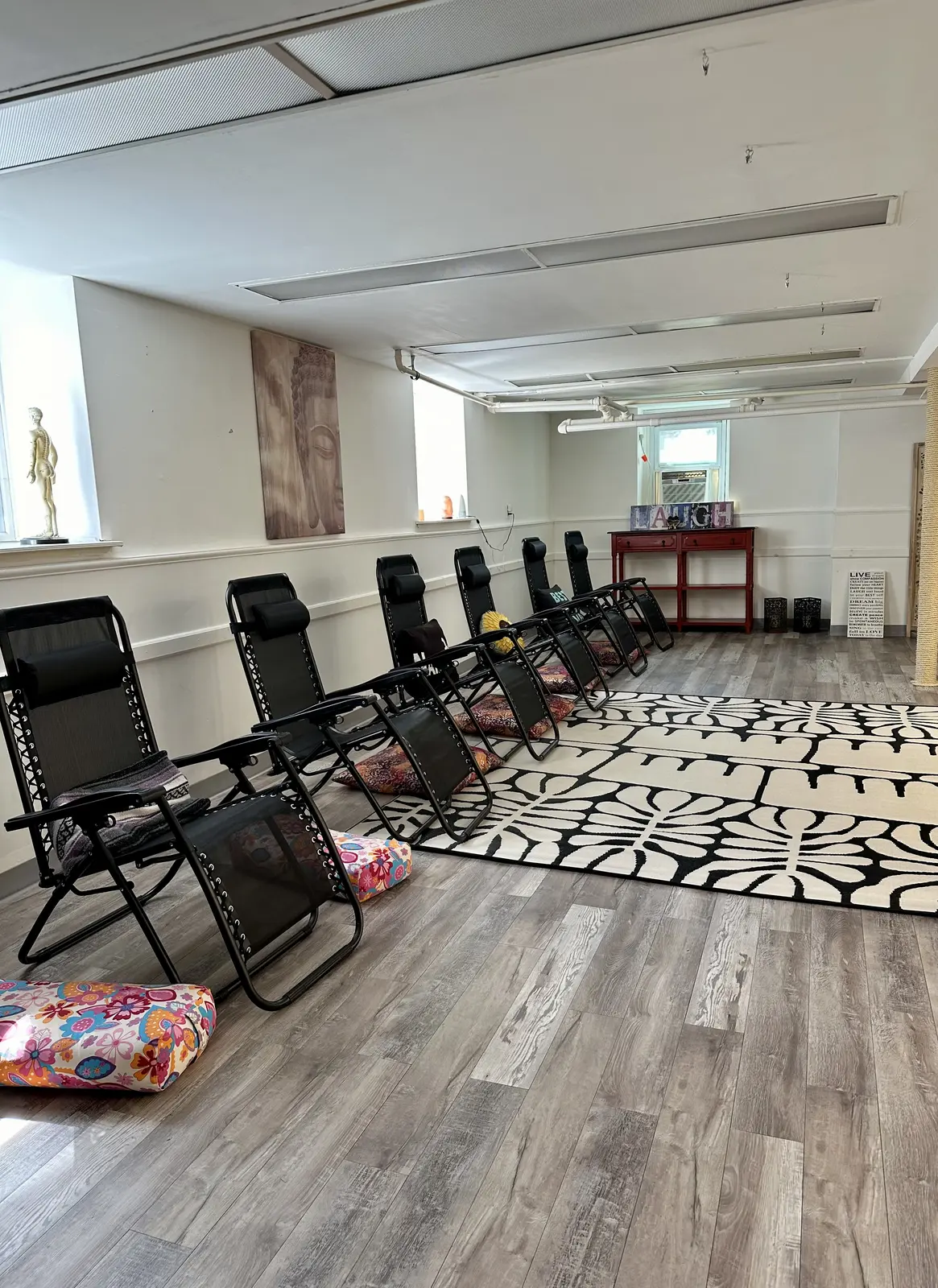 A room set with recliners for a group meditation class