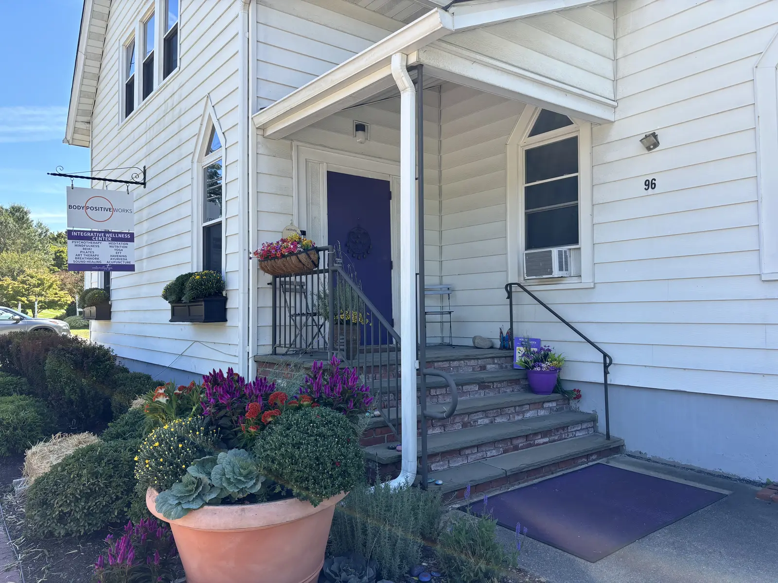 The studio entrance and porch with seasonal flowers